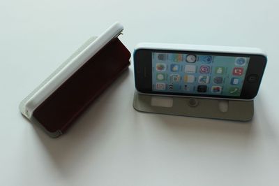 IPHONE 5C 雙開窗支撐電壓帶鉆皮套 功能、特色與市場價(jià)值
